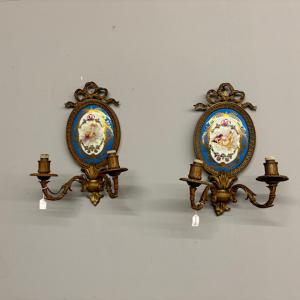 Antique pair of bronze sconces with painted plaque. First half of the 20th century, Limoges, France